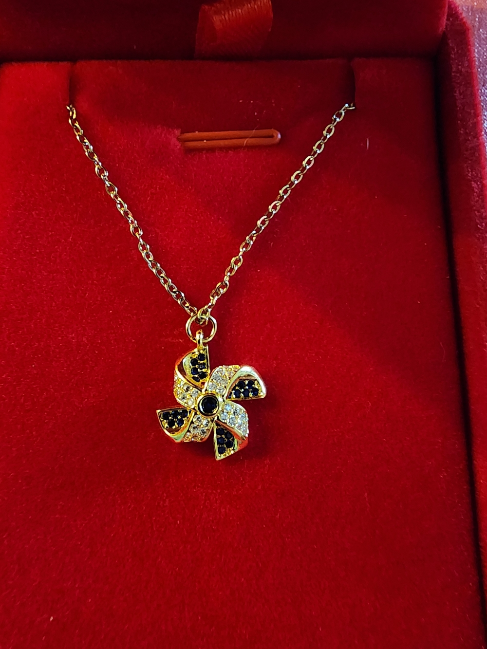 Gold Tone Blue & Clear Crystal Pinwheel Pendant Necklace